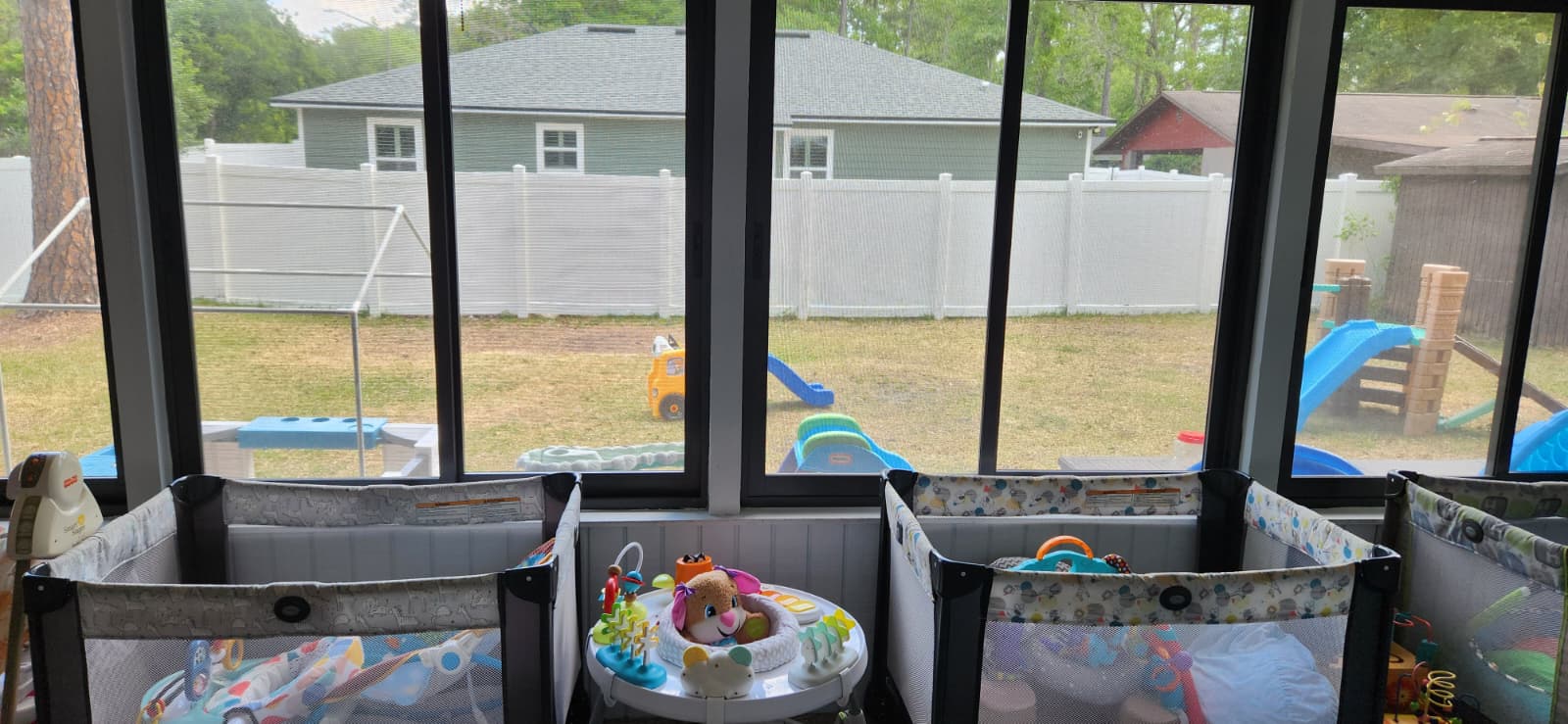 Indoor care area with view of the outdoor play yard